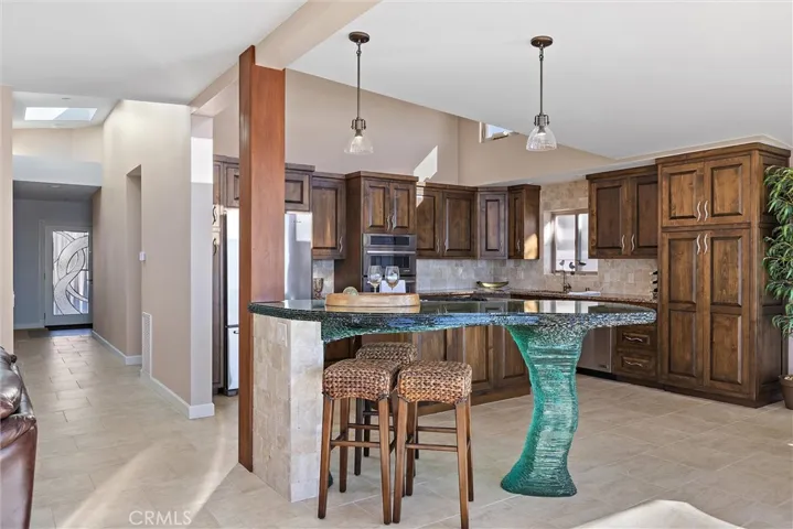 Kitchen with Alder cabinets with touch of wave inspiration