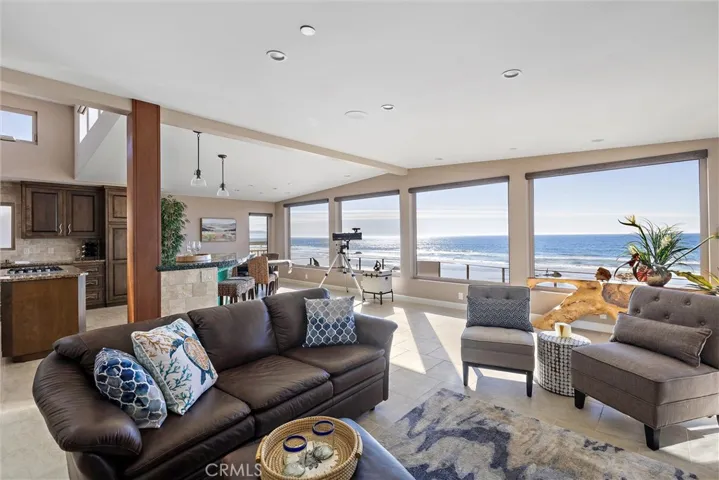 Living room open to dining room and kitchen. Looking towards Morro Bay.
