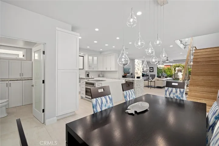 Dining area with designer light fixture