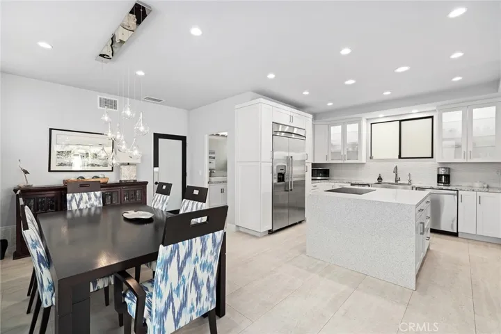 Dining area with designer light fixture