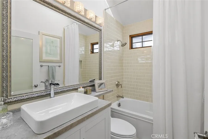 Hall bathroom with tub and shower