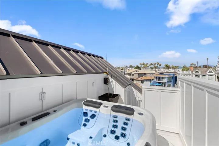 Roof top deck with Bullfrog spa accessible with a circular staircase