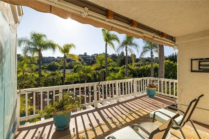 Tranquil upstairs deck with backyard views