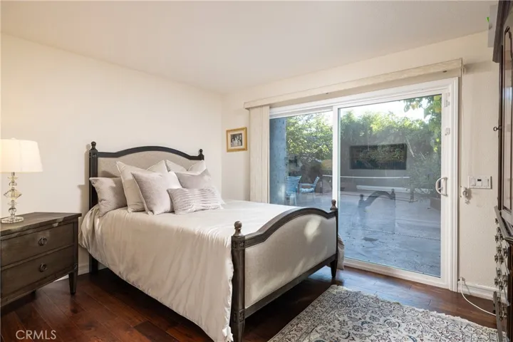 Main floor bedroom with sliding doors to the backyard