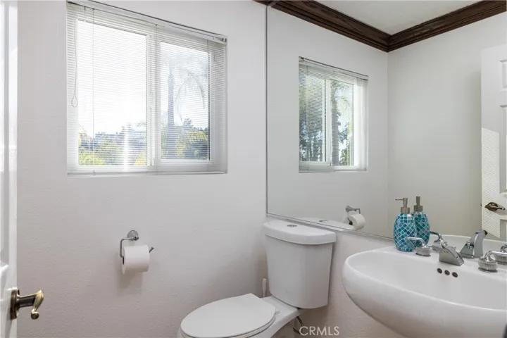Convenient half bath in hallway off office/bonus room