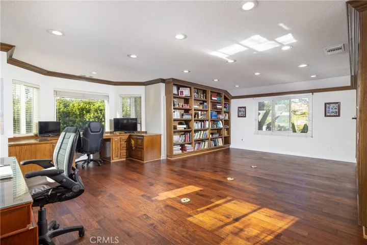 Upstairs office/bonus room with built-in bookshelves