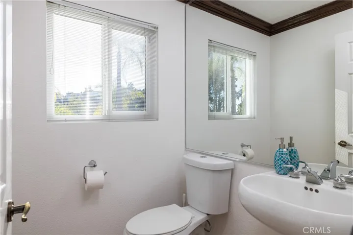 Convenient half bath in hallway off office/bonus room