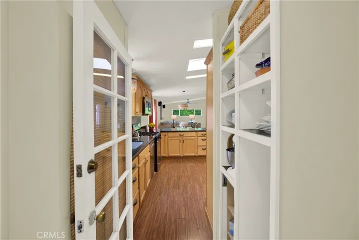 Hall with storage off kitchen