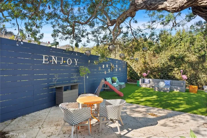 Uppermost section of the backyard has a very private area for sitting and relaxing that is shaded and landscaped.