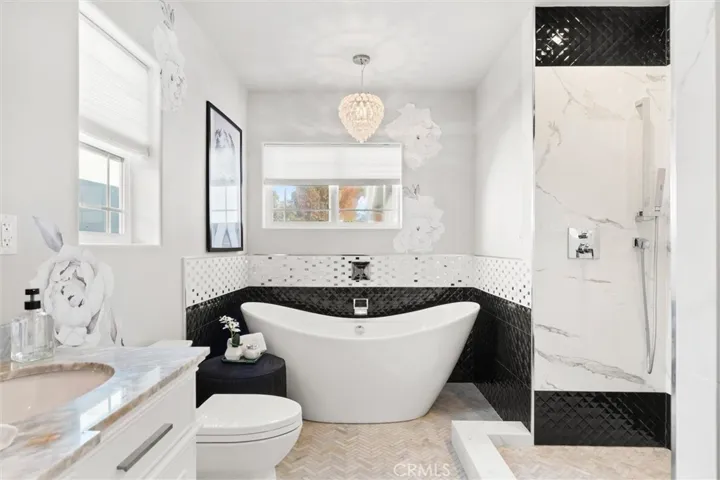 Custom tile work and a soaking tub in the ensuite bathroom.