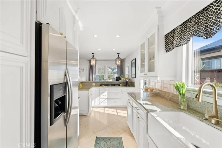 View of the kitchen from the back. Countertop stove