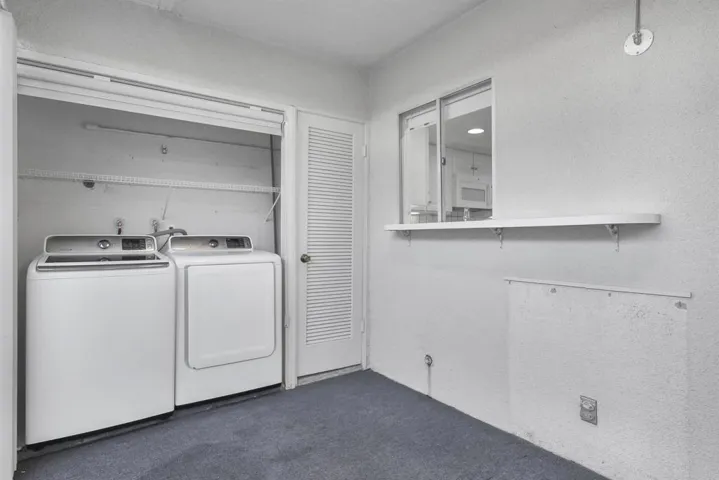Features include laundry, kitchen pass through window and access to back patio.