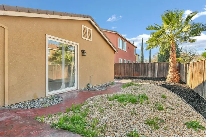 View of fenced backyard
