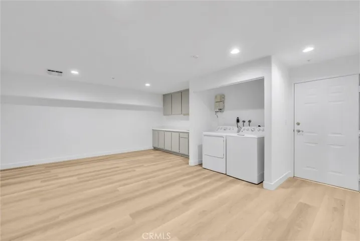 Den- complete with washer, dryer, and sink