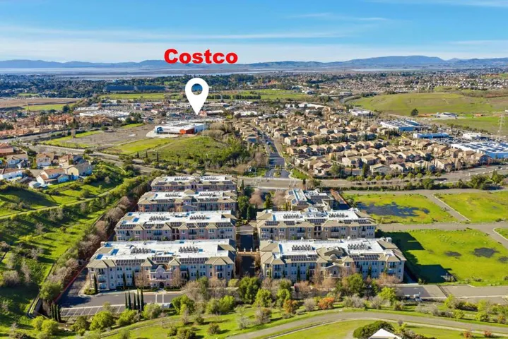 Aerial perspective of suburban area featuring a mountainous background