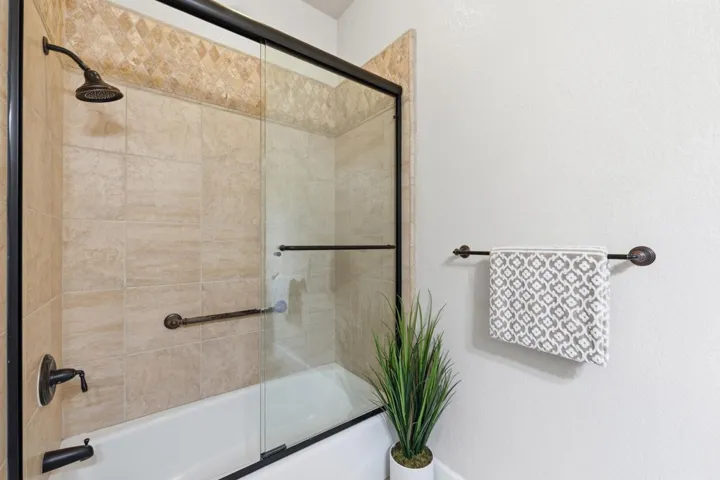Full bathroom featuring enclosed tub / shower combo