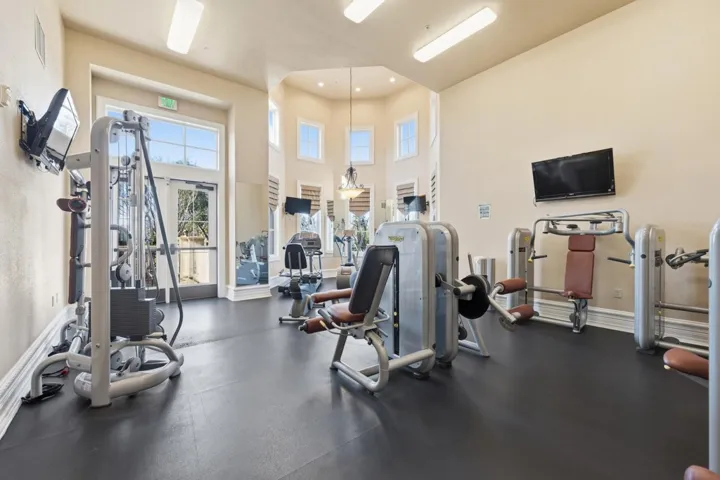Workout area featuring a high ceiling
