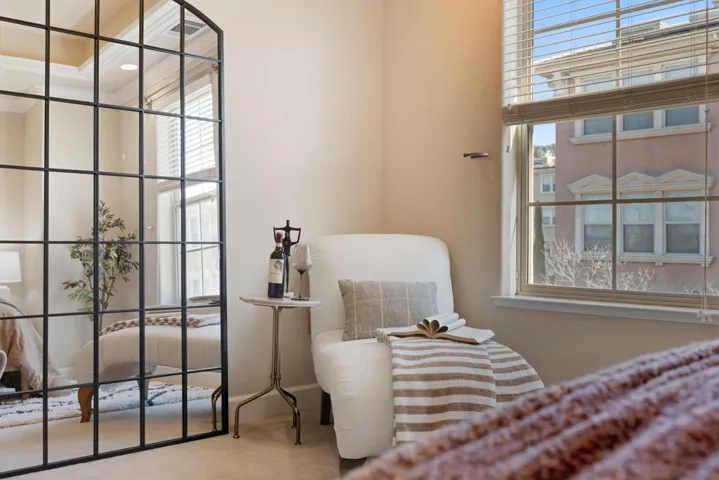 Living area featuring carpet and healthy amount of natural light