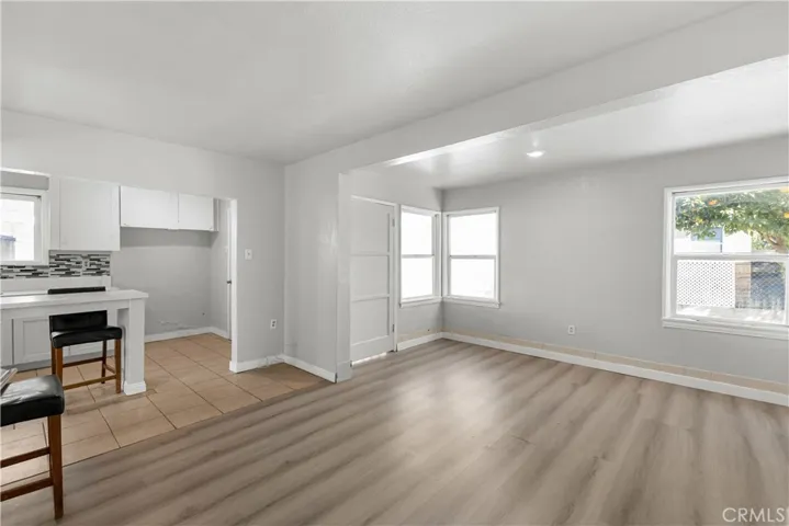 The rear unit features a spacious living room area with an open-concept layout connected to the kitchen.