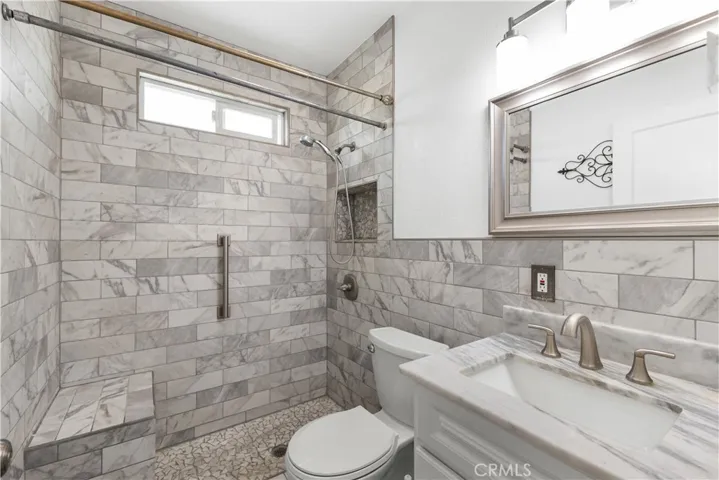 Fully tiled renovated bathroom