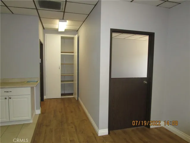 Storage closet at end of hall next to bathroom.