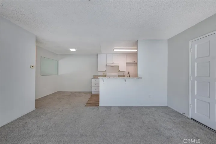 Another angel of living room, dining room, not staged