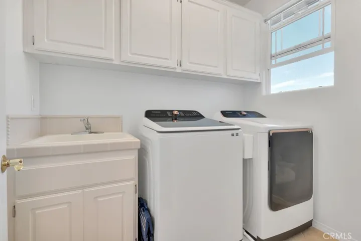Laundry room upstairs with utility sink