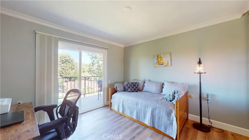 Second bedroom has a trundle bed and desk area.