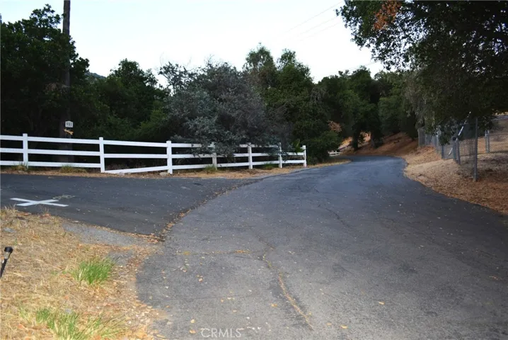 right after the fork in the road with parking & turn-around available, a rare benefit.
