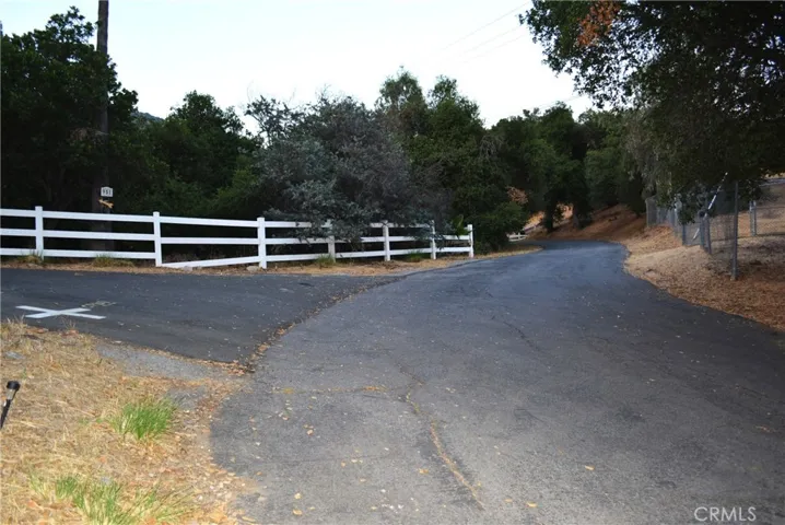 right after the fork in the road with parking & turn-around available, a rare benefit.