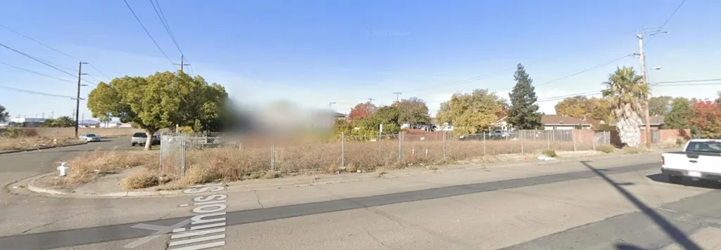 View of asphalt street featuring curbs