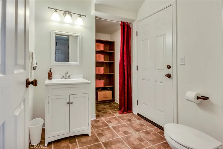 Ground level half bath with exterior access to back yard.