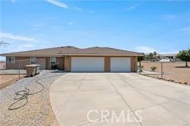 Wide driveway and multi-car garage with excellent access.