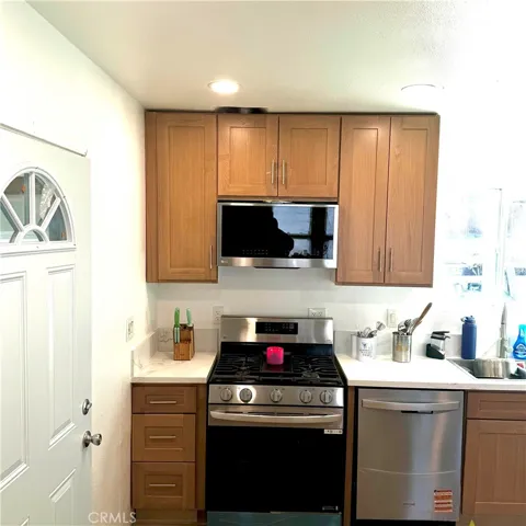 Kitchen Area: Stove, microwave, & dishwasher