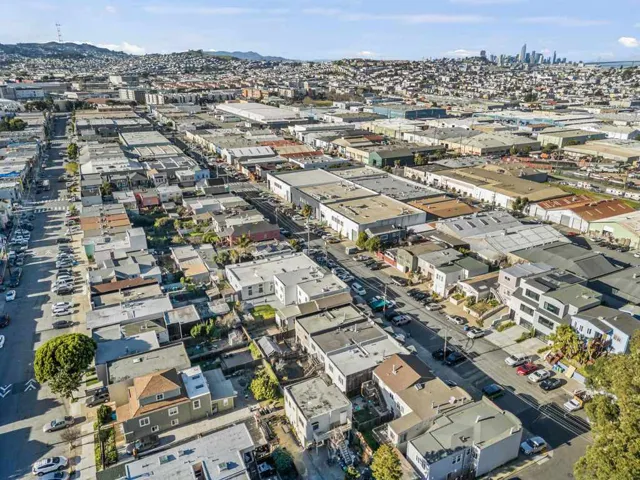 Aerial view of property's location featuring nearby urban area