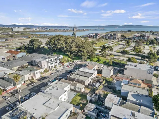View of property location featuring a large body of water and a notable bridge