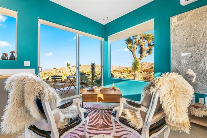 Casita sitting area with oversize slider leading to patio