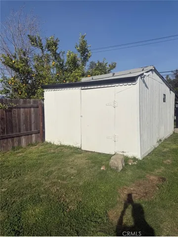 Storage or workshop building next to car park