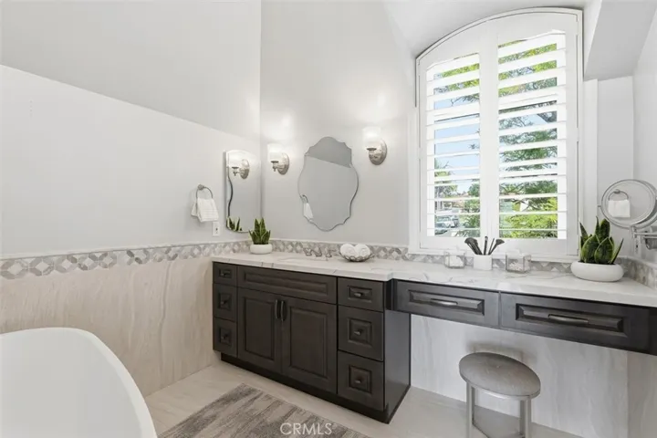 Primary Bathroom with sink, vanity & soaking tub