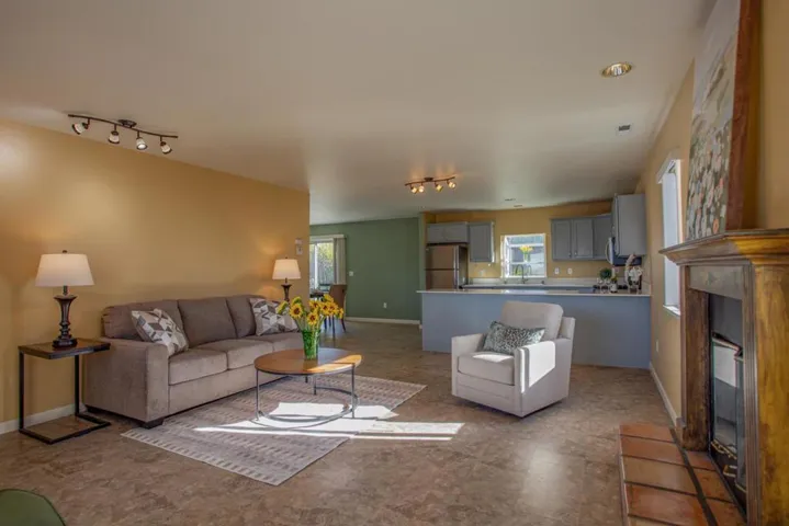 Open Concept living room with warm welcoming color pallets.