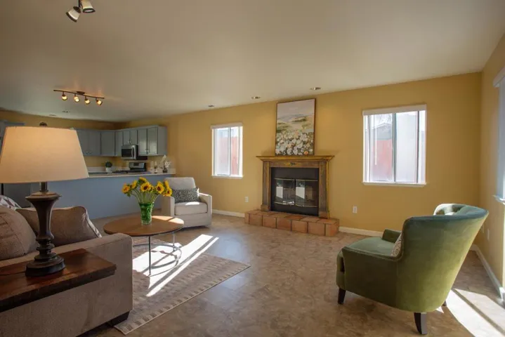 Spacious light and airy living room w/fireplace.