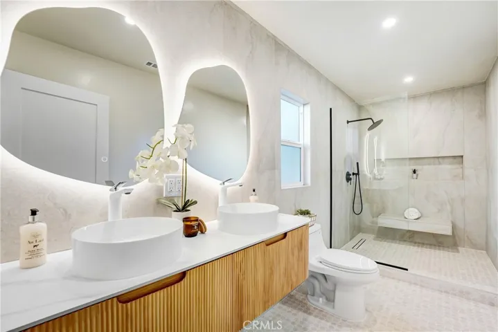 double sinks in master bath, rain showerhead, shower bench