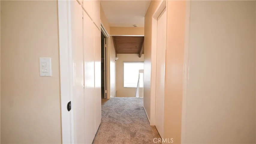 VIEW OF HALLWAY WITH STORAGE CLOSET