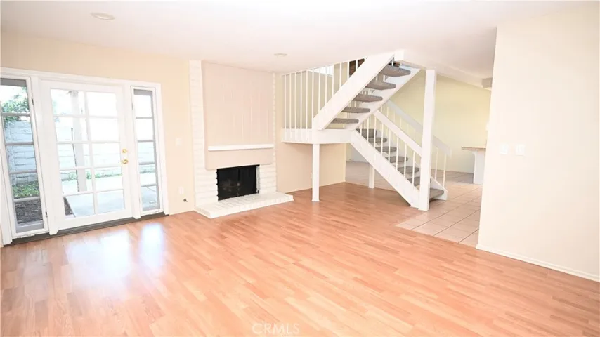 LIVING ROOM WITH FIRPLACE AND DIRECT ACCESS TO BACK PATIO
