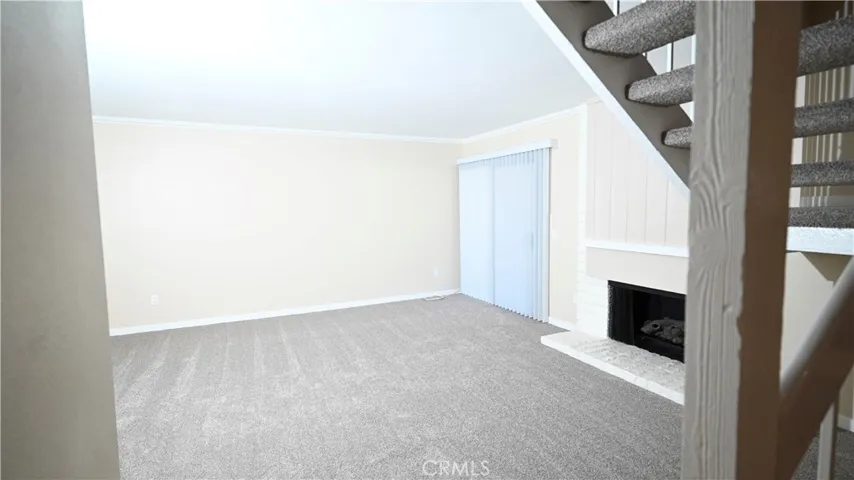 LIVING ROOM WITH FIREPLACE AND DIRECT ACCESS TO BACK PATIO