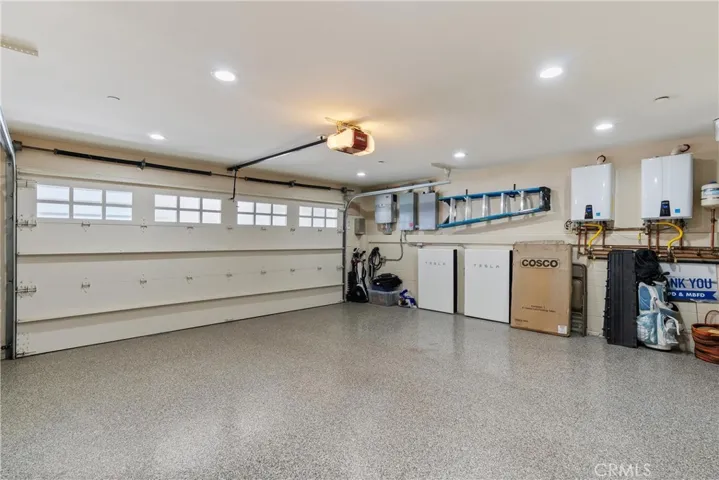 3-Car Garage with 2 Tankless Water Heaters and 2 Tesla Battery Power Walls