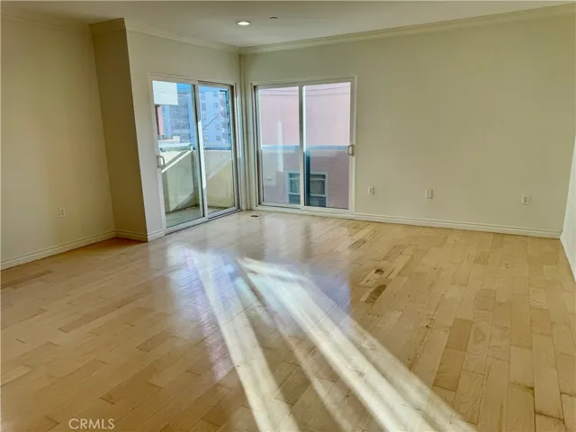 spacious living room with refurbished wood floor