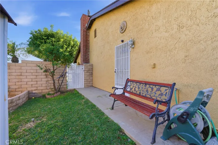 Back side yard looking towards kitchen access door and side gate