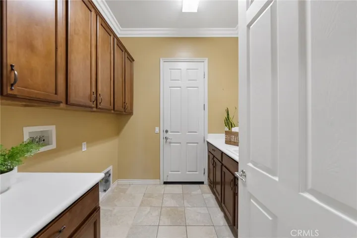 Laundry with direct access to garage, sink and lots of storage!