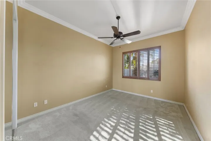 Bedroom #1 with mirrored wardrobe and plantation shutters